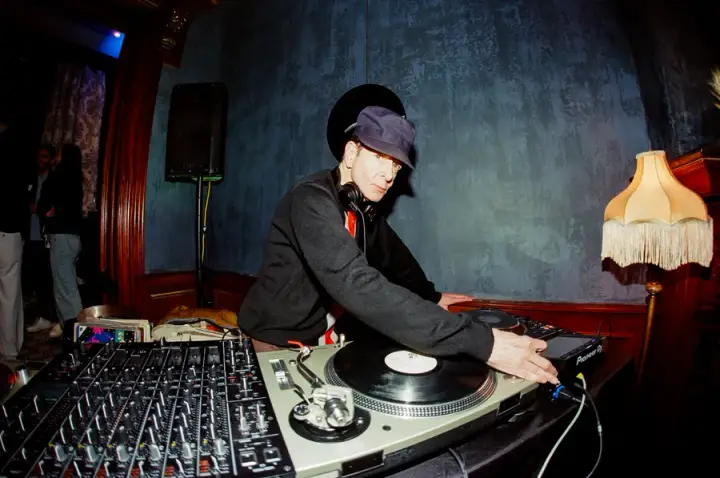DJ playing vinyl records at an AirOps party